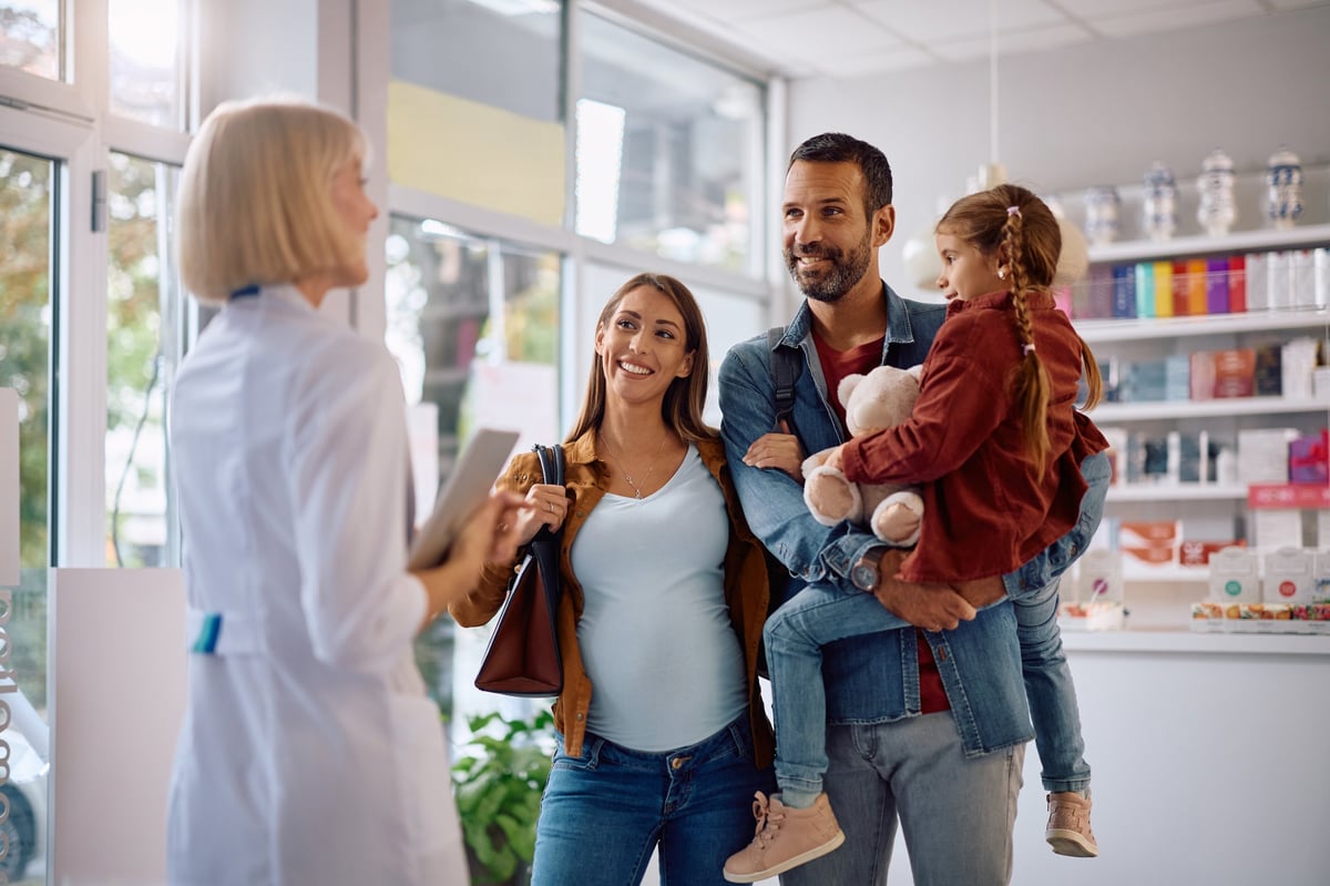 Family communicating with their pharmacist